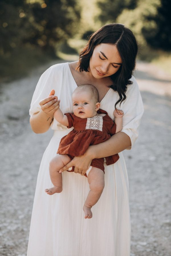 Mother with baby daughter in park